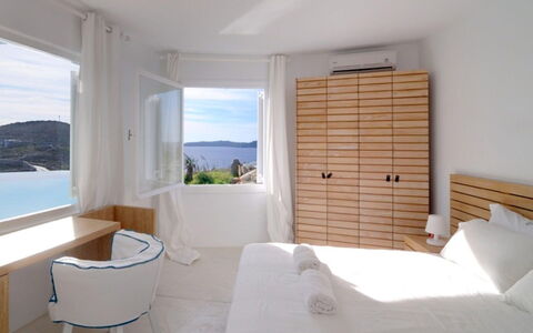 Villa Delos: Furniture, Sea, Coastal And Oceanic Landforms, Bedroom, Ocean, Linens, Coast, Resort, Bed, Bedding
