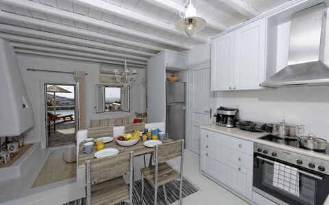 Villa Fos: Furniture, Apartment, Chair, Shade, Design, Countertop, Cabinetry, Kitchen & Dining Room Table, Penthouse Apartment, Kitchen