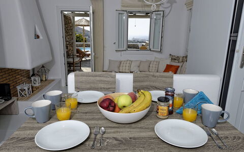 Villa Fos: Furniture, Tableware, Table, Chair, Serveware, Interior Design, Drinkware, Food, Dishware, Kitchen & Dining Room Table