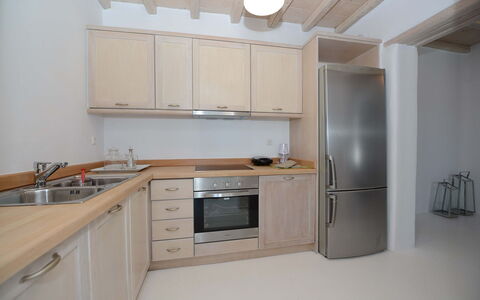 Villa Gazelia: Kitchen, Countertop, Kitchen Appliance, Cabinetry, Major Appliance, Furniture, Interior Design, Wood, Flooring, Kitchen Sink