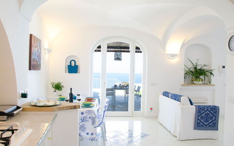 Villa Il Sogno di Praiano: Blue, Furniture, Arch, Home, Chair, Apartment, Kitchen & Dining Room Table, Houseplant, Flowerpot, Dining Room