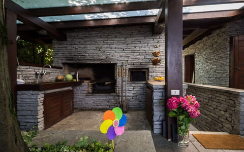 Villa Isa: Wood, Brick, Furniture, Brickwork, Chair, Garden, Stone Wall, Wood Stain, Flagstone, Kitchen & Dining Room Table
