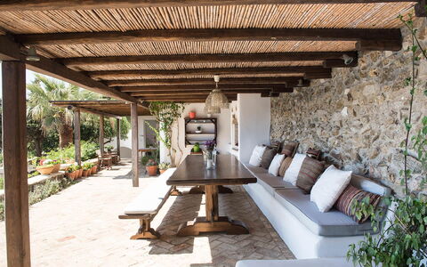 Villa Oasis: Wood, Furniture, Flowerpot, Outdoor Furniture, Beam, Ceiling, Porch, Flagstone, Houseplant, Chair