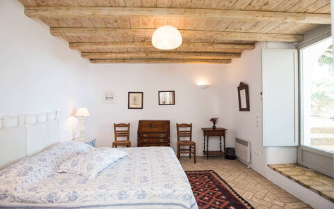 Villa Oasis: Bed, Furniture, Interior Design, Bedroom, Wall, Floor, Flooring, Bedding, Ceiling, Room