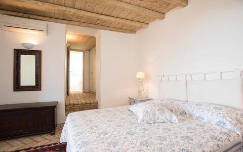 Villa Oasis: Bed, Bedroom, Furniture, Wall, Floor, Flooring, Interior Design, Bed Sheet, Bedding, Wood