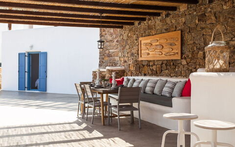 Villa Smaràgdi: Furniture, Flooring, Floor, Chair, Stone Wall, Kitchen & Dining Room Table, Outdoor Furniture, Brick, Shade, Living Room