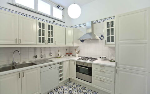 Villa Torre del Sole: Kitchen, Countertop, Cabinetry, Kitchen Appliance, Flooring, Major Appliance, Interior Design, Floor, Kitchen Stove, Cupboard