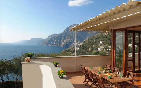 Villa Valeria: Furniture, Table, Chair, Coastal And Oceanic Landforms, Sea, Coast, Outdoor Furniture, Resort, Mountain Range, Kitchen & Dining Room Table