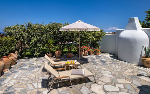 Guest House Sorokos: Flowerpot, Outdoor Furniture, Flagstone, Garden, Chair, Houseplant, Shade, Landscaping, Patio, Courtyard