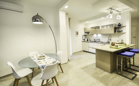 Casa Primavera: Interior Design, Flooring, Furniture, Ceiling, Floor, Wood, Countertop, Room, Light Fixture, Kitchen
