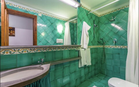 Villa Olivia: Interior Design, Flooring, Floor, Plumbing Fixture, Tap, Tile, Plumbing, Bathroom, Wood Stain, Bathroom Sink