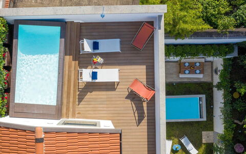 The Ivy Penthouse: Swimming Pool, Composite Material, Leisure, Outdoor Furniture, Resort, Wood Stain, Eco Hotel, Shade, Chair, Deck