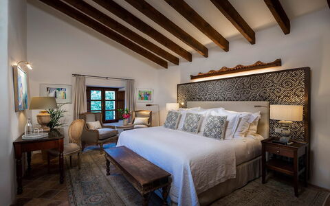 Villa Carlos: Furniture, Interior Design, Floor, Flooring, Bed, Wood, Bedroom, Ceiling, Home, Lighting