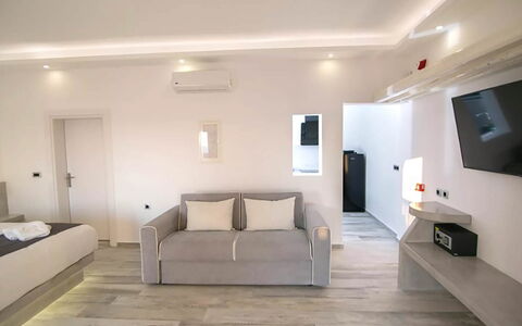 Maison Nira: Flooring, Furniture, Interior Design, Floor, Apartment, Couch, Room, Living Room, Suite