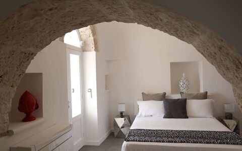 Trulli Maria: Wall, Furniture, Interior Design, Bedroom, Ceiling, Lighting, Room, Bed, Linens, Home