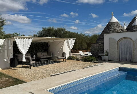 Trulli Maria: Outdoor Furniture, Flagstone, Shade, Chair, Landscaping, Swimming Pool, Outdoor Structure, Yard, Backyard, Patio