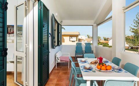 Ippocampo: Door, Chair, Apartment, Outdoor Furniture, Shade, Balcony, Awning, Houseplant, Outdoor Table, Kitchen & Dining Room Table