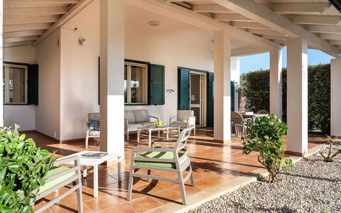 Kalimba: Furniture, Flooring, Floor, Outdoor Furniture, Porch, Chair, Shade, Patio, Outdoor Table, Outdoor Structure