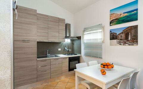 Ninfa: Kitchen Appliance, Kitchen, Major Appliance, Flooring, Interior Design, Countertop, Wood, Furniture, Home Appliance, Floor