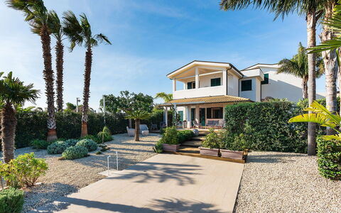 Stella Marina: Residential Area, Architecture, Shrub, Home, Estate, Shade, Garden, Driveway, Landscaping