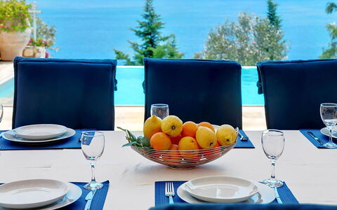 Red Villa: Furniture, Blue, Tableware, Table, Chair, Serveware, Sea, Interior Design, Kitchen & Dining Room Table, Restaurant