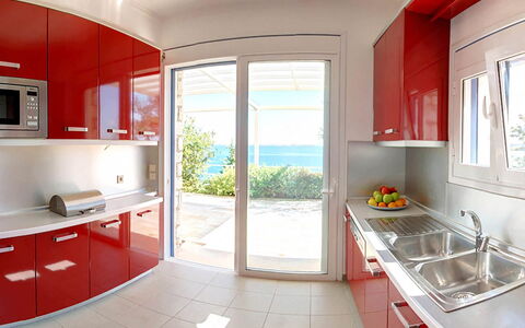 Red Villa: Flooring, Kitchen, Furniture, Interior Design, Major Appliance, Floor, Home, Countertop, Cabinetry, Kitchen Appliance
