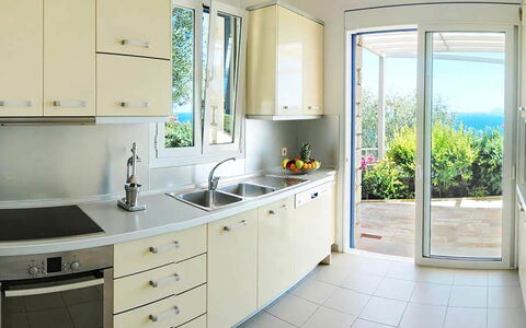 Villa Aspro: Kitchen, Furniture, Countertop, Kitchen Appliance, Flooring, Interior Design, Wood, Major Appliance, Cabinetry, Home