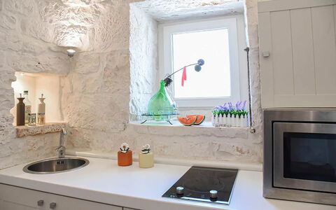 Trulli Martina: Wall, Kitchen, Interior Design, Countertop, Flooring, Kitchen Appliance, Lighting, Plumbing Fixture, Tap, Home