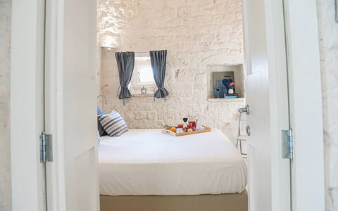 Trulli Martina: Wall, Interior Design, Bedroom, Textile, Furniture, Bed, Room, Floor, Flooring, Home