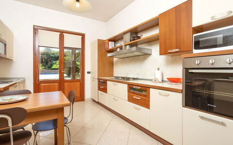 Villa Acquamarina: Kitchen, Countertop, Kitchen Appliance, Wood, Cabinetry, Flooring, Major Appliance, Interior Design, Furniture, Home