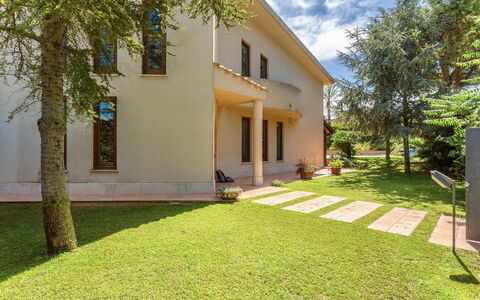 Villa Acquamarina: Building, Home, Residential Area, House, Architecture, Shrub, Lawn, Door, Garden, Estate