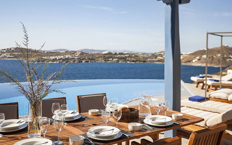 Villa Anassa: Furniture, Restaurant, Outdoor Furniture, Chair, Boat, Sea, Kitchen & Dining Room Table, Barware, Resort, Shade