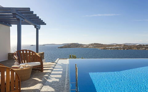 Villa Anassa: Blue, Water, Swimming Pool, Outdoor Furniture, Resort, Sea, Sunlounger, Chair, Shade, Villa
