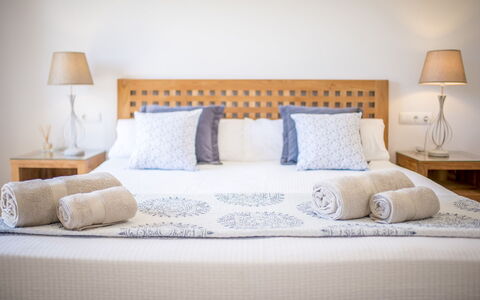 Villa Sharon: Bed, Bedding, Furniture, Bedroom, Bed Sheet, Interior Design, Linens, Wood, Floor, Cushion