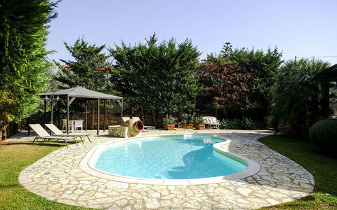 Villa Virna: Swimming Pool, Resort, Outdoor Furniture, Flagstone, Backyard, Shade, Eco Hotel, Garden, Umbrella, Water Feature