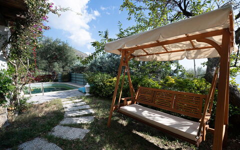 Villa Eva: Wood, Furniture, Garden, Shade, Outdoor Furniture, Outdoor Structure, Landscaping, Wood Stain, Backyard