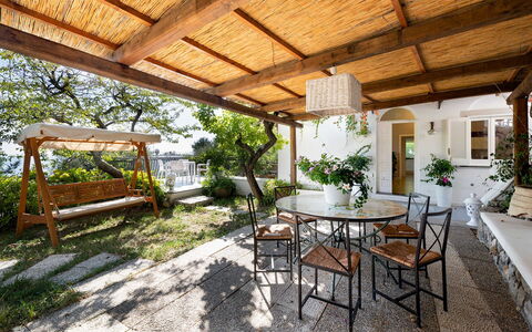 Villa Eva: Furniture, Table, Chair, Outdoor Furniture, Porch, Flowerpot, Outdoor Table, Floor, Kitchen & Dining Room Table, Patio