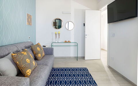 Thyme: Furniture, Interior Design, Flooring, Floor, Wall, Couch, Wood, Room, Home, Living Room