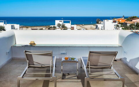 Villa Orietta: Furniture, Outdoor Furniture, Chair, Shade, Natural Material, Coffee Table, Houseplant, Balcony, Flowerpot, Resort