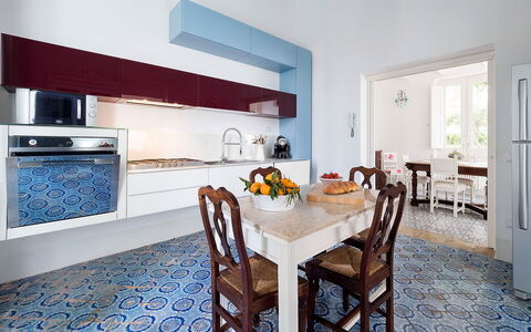 The Flower Garden: Flooring, Interior Design, Kitchen, Countertop, Floor, Furniture, Kitchen Appliance, Cabinetry, Major Appliance, Lighting