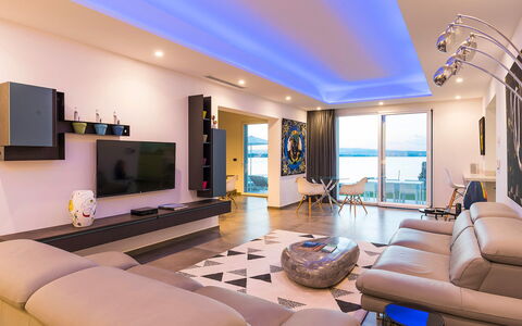 Sea Art Villa: Interior Design, Furniture, Flooring, Ceiling, Floor, Apartment, Television, Living Room, Lighting, Room