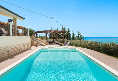 Villa Carousel: Blue, Water, Swimming Pool, Resort, Composite Material, Sea, Leisure, Outdoor Furniture, Eco Hotel, Ocean