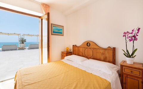 Relais Nike: Furniture, Interior Design, Sea, Resort, Apartment, Chair, Ocean, Hotel, Coast, Bed