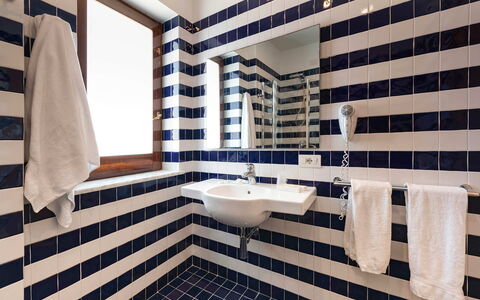 Relais Nike: Blue, Interior Design, Bathroom, Flooring, Plumbing Fixture, Floor, Bathroom Sink, Tile, Composite Material, Plumbing
