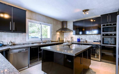 Villa Angelic: Kitchen Appliance, Kitchen, Countertop, Cabinetry, Major Appliance, Home Appliance, Furniture, Interior Design, Kitchen Stove, Flooring