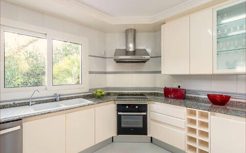 Villa Besso: Kitchen, Kitchen Appliance, Countertop, Cabinetry, Interior Design, Major Appliance, Flooring, Wood, Home Appliance, Kitchen Stove