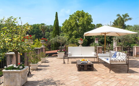 Villa Carosone: Furniture, Flowerpot, Garden, Outdoor Furniture, Table, Chair, Flagstone, Shade, Houseplant