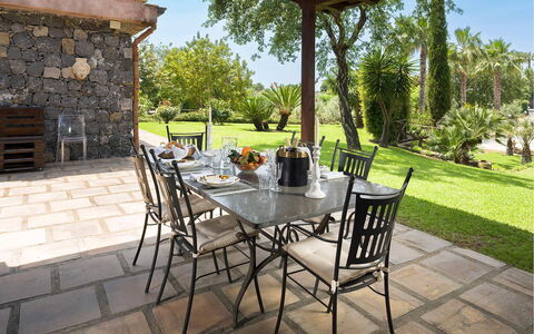 Villa Carosone: Furniture, Chair, Table, Outdoor Furniture, Kitchen & Dining Room Table, Outdoor Table, Restaurant, Dining Room, Shade, Patio