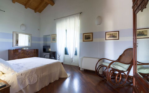 Villa Carosone: Furniture, Interior Design, Flooring, Floor, Ceiling, Room, Bedroom, Lighting, Bed, Home