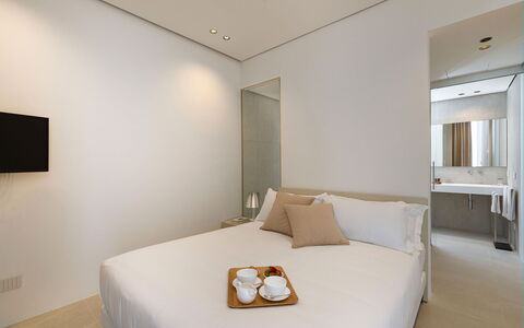Villa Confini: Interior Design, Wall, Bed, Floor, Bedroom, Flooring, Wood, Furniture, Bed Sheet, Bedding